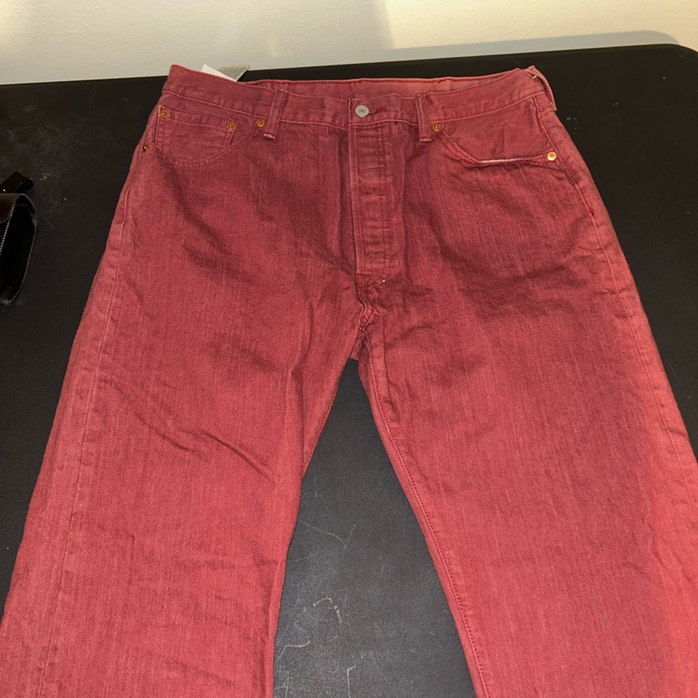 Red Levi’s 501 with buttonup fly